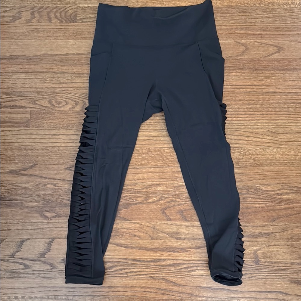 Athleta black Powervita 7/8 Leggings with Side Detailing, Size Medium
